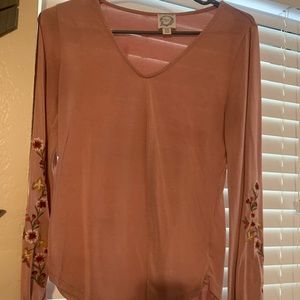 Cute, dusty rose top with floral print on the sides